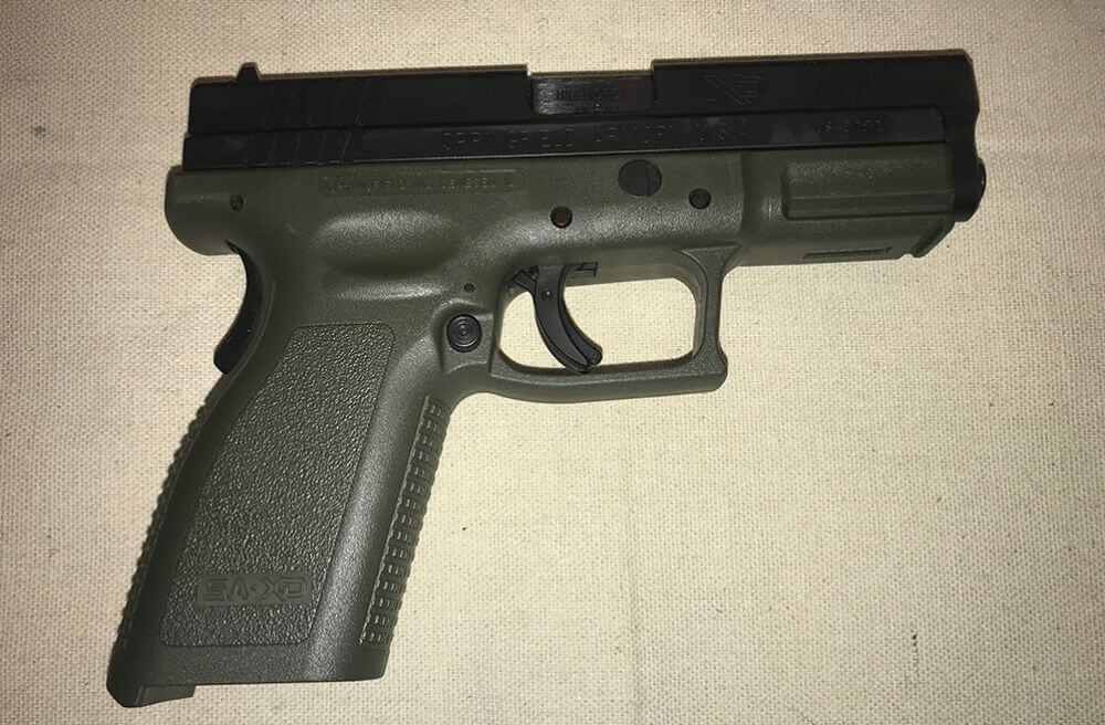 A Springfield Armory XD handgun BEFORE firearm destruction in California.